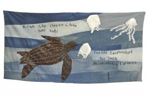 Pacific Leatherback Sea Turtle Background made of old jeans sewn together on a 1906 Singer treadle machine. Sea turtle, jellyfish, and plastic bags made from remnant fabric donated by the Center Theater Group Costume Shop. Fabric paint and rubber stamps. 